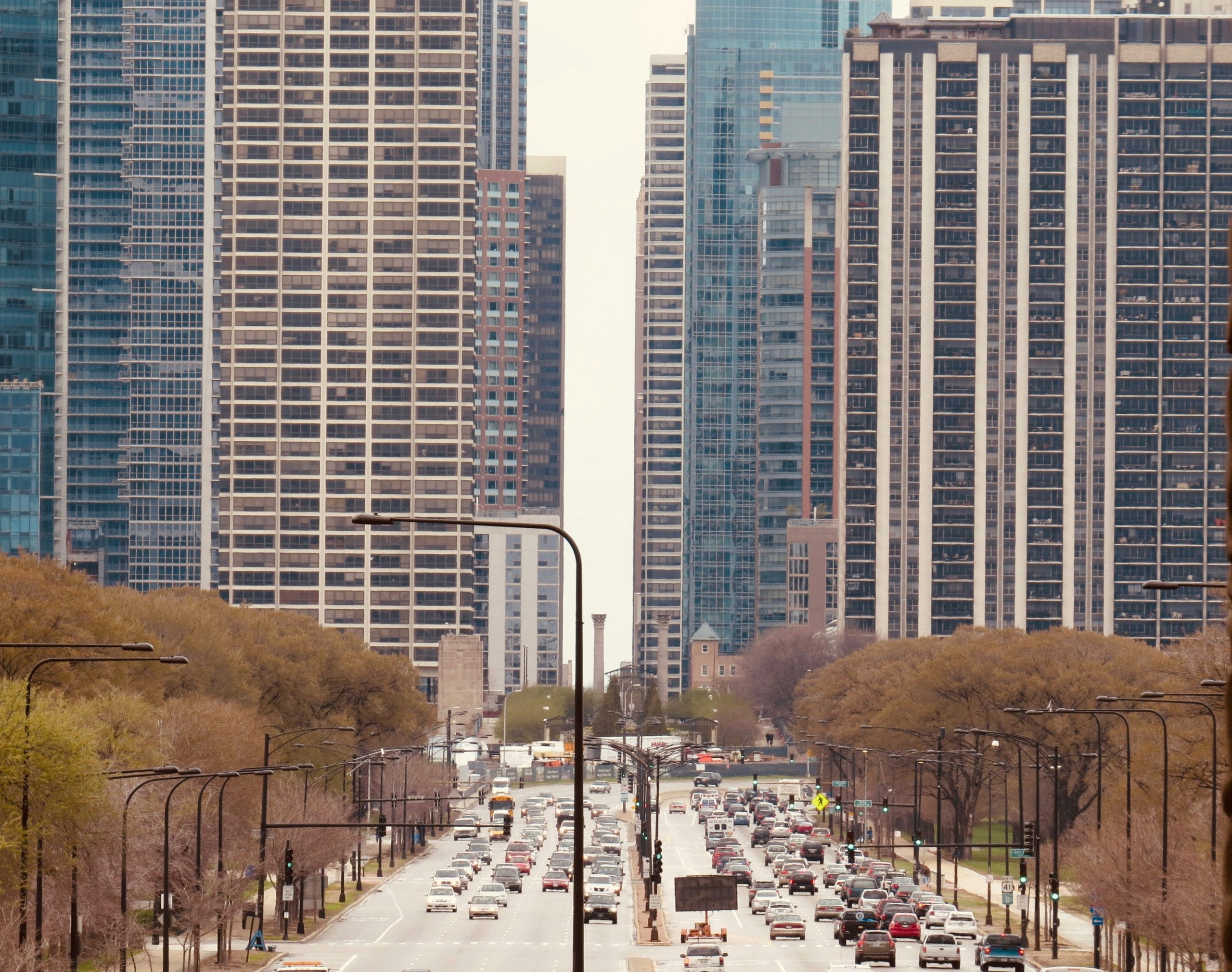 Cars on a downtown Chicago street near high-rise buildings
