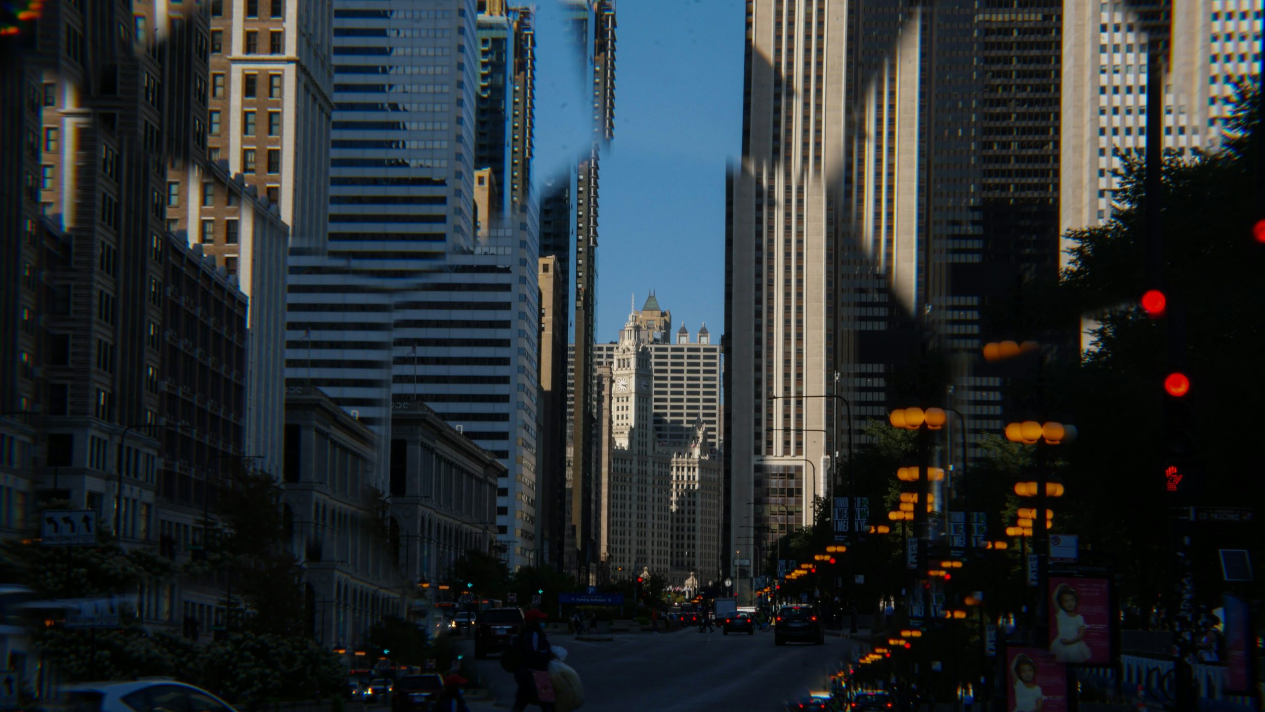 Chicago street with traffic, tall buildings, and traffic lights