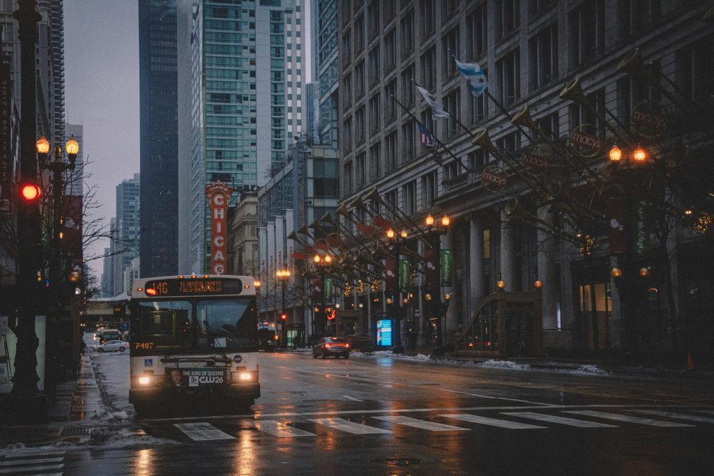 Night traffic on a Chicago street with city lights