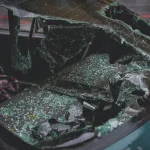 Shattered car windshield after a collision accident showing vehicle damage