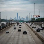 Chicago skyline with busy highway traffic showing urban driving conditions
