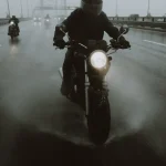Motorcyclists riding on a highway in rain representing motorcycle accident claims in Chicago