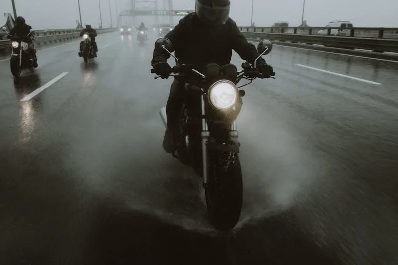 Motorcyclists riding on a highway in rain representing motorcycle accident claims in Chicago